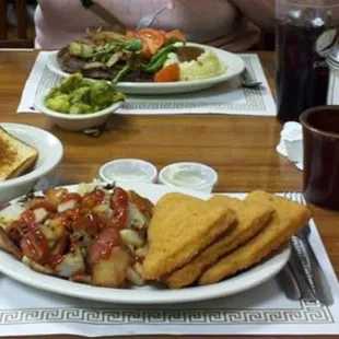 "Three Piece Cod Fish Dinner" with home fries and a salad.  Plus, "Dragster Steak" with homemade mashies and thick brown gravy!