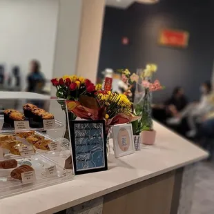 a counter with a variety of pastries on it