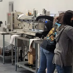 a group of people in a kitchen