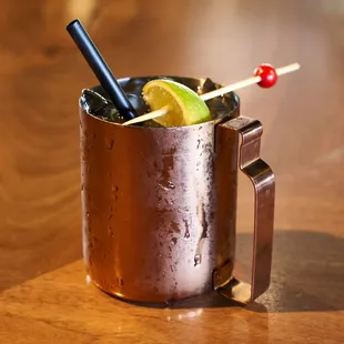 a cocktail in a copper mug