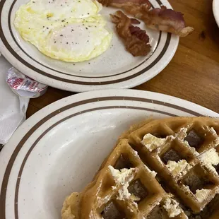 Pecan waffle with eggs and bacon