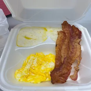 bacon and eggs in a styrofoam container