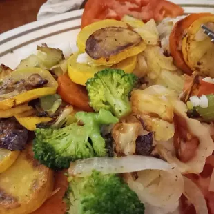 a plate of vegetables with a fork
