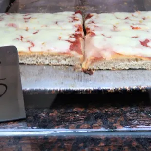 $5.25 for a small slice of Sicilian at lousy Famous Ben&apos;s Pizza on June 22, 2022. A ripoff joint ... caveat emptor!