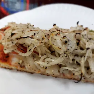 a slice of onion pizza