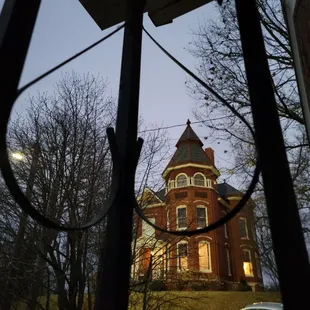 a large red brick building with a clock tower