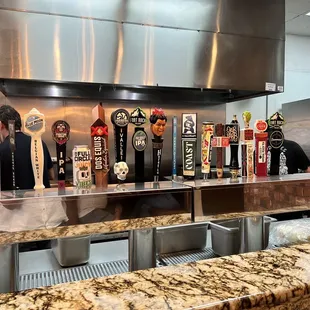a row of beer taps