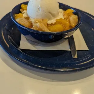 Peach cobbler with ice cream
