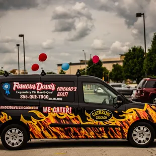 ows a van decorated with flames