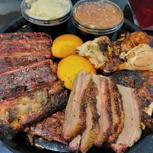 a plate of meat and sides