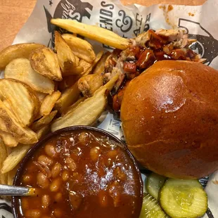 Pulled pork , French fries and baked beans .