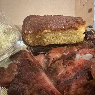 a plate of meat and a cake