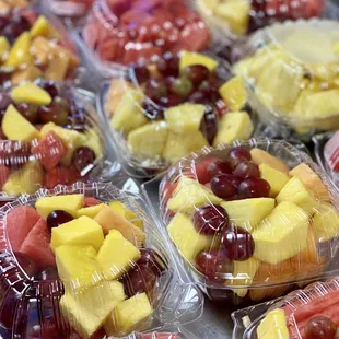 a variety of fruit in plastic containers
