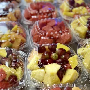 a variety of fruit in plastic containers
