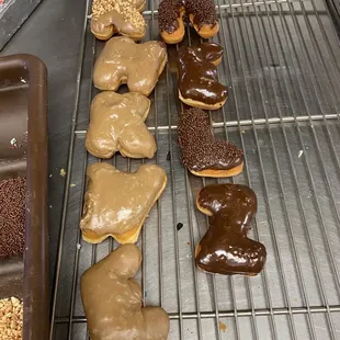 a variety of donuts on a cooling rack