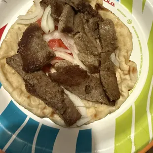 No lettuce, no olives, no cucumbers, only white onions, and a few pieces of tomato.