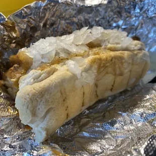 Loaded hotdog. They don't go easy on the onions.