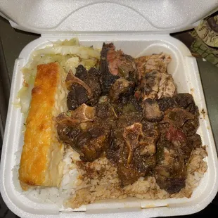 Oxtails , Jerk Chicken. White rice , Mac &amp; Cabbage