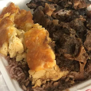 Oxtail, jerk chicken, macaroni and cheese, rice and peas!