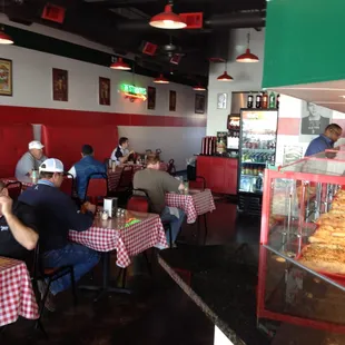 a man sitting at a table in a restaurant