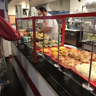 a man serving food to a customer