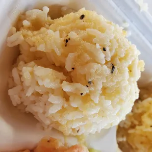 Close up of the rich buttery garlic sauce over the rice.