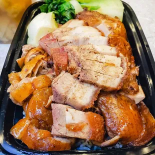 Trio combo rice with shoyu chicken, roasted pork, and BBQ duck.  IG: @take.a.bite.with.me