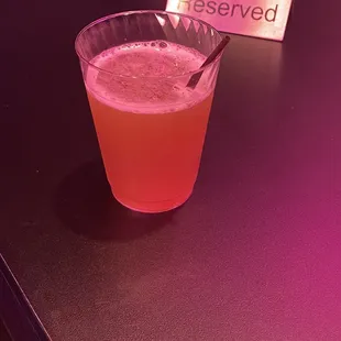 a drink in a glass on a table
