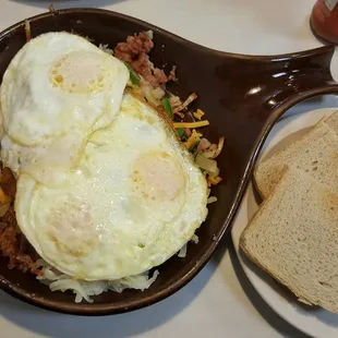 Irish Skillet $7.59 3 eggs on a pile of low sodium corned beef hash, onions, and peppers.    Plan on taking some home!