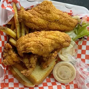 a basket of fried fish and fries