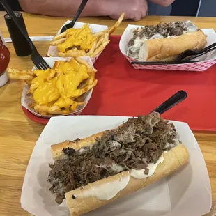 2 regular basic philly cheesesteaks and 2 regular crabby fries