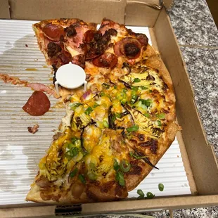 a half eaten pizza in a box