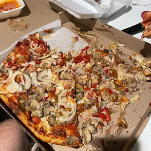 Monster pizza drowned in toppings