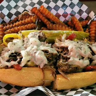 Philly cheesesteak with sweet potato fries.