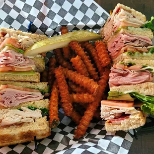 Sam&apos;s club sandwich with sweet potato fries.