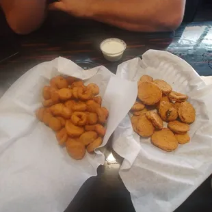Fried pickles (right) and jalapeno poppers (aka bottle caps, left)