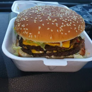 An amazing Double cheese burger with all the fixings.