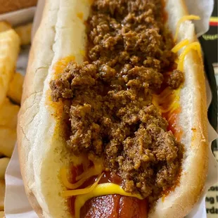 a hot dog with chili and cheese
