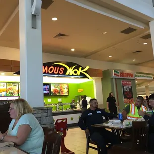people sitting at tables in a restaurant