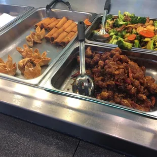 a variety of food items in a buffet