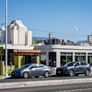 cars parked in front of a restaurant