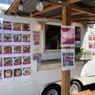 a food truck with menus on it
