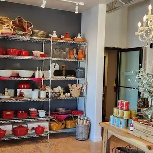 Stoneware &amp; cookware. Note: top left red pot is a Moroccan tagine cooking vessel. Don't see that every day.