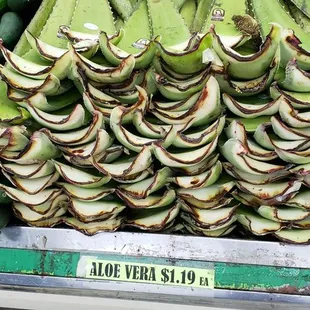a display of bananas and cucumbers