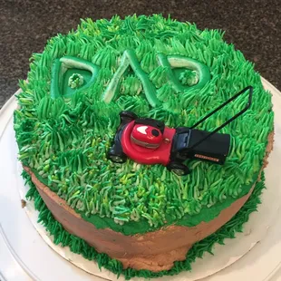 Father&apos;s Day cake (I added lawn mower) Poorly iced; what&apos;s with the large lump?