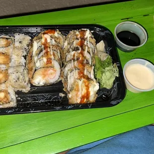 Shrimp tempura roll and two dynamite rolls