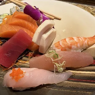 Sushi sashimi combination. Already ate one piece.