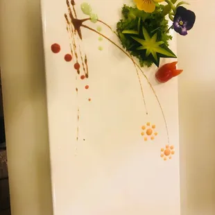 a plate with a flower arrangement on it
