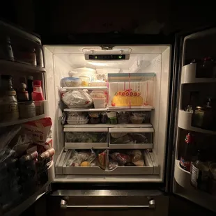 Cake barely fitting in the fridge after a night out