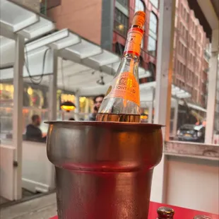a bottle of champagne in an ice bucket